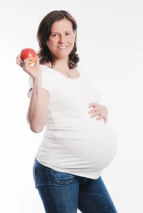 pregnant woman with an apple