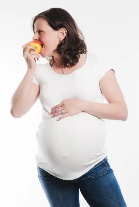 pregnant woman with an apple