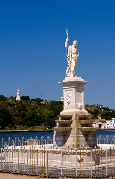 River and statues with Christ statue on hill in background in Havana Cuba Habana