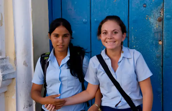 Two student girls aged 14 in uniform in Trinidad Cuba