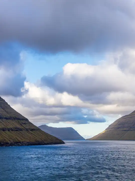 View of the rocks of the Faroe Islands with clouds.