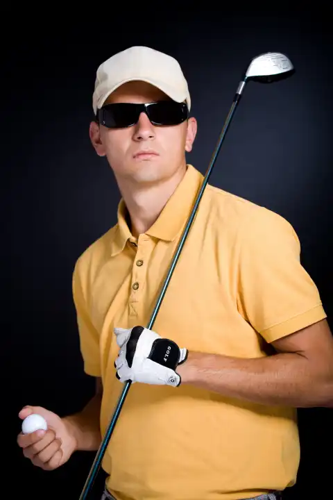 the male golf player with a driver