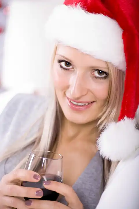 portrait of a young woman with Santa Claus hat