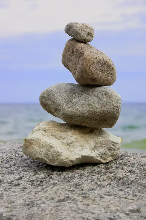cairn, stone column on the beach of Travemünde at the Baltic Sea