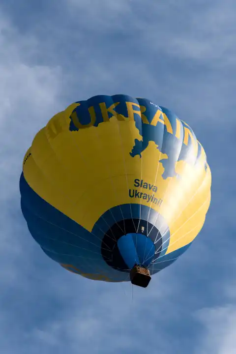KIEL, GERMANY - JUNE 17, 2023: During the Kieler Woche 2023 Hot Air Balloons take off at the International Balloon Sail. With them is a balloon from Ukraine