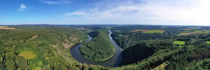 Aerial view of the Saar loop. The Saar winds its way through the valley and is surrounded by green forests. Orscholz, Mettlach, Saarland, Germany