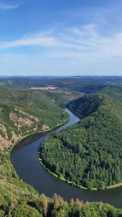 Aerial view of the Saar loop. The Saar winds its way through the valley and is surrounded by green forests. Orscholz, Mettlach, Saarland, Germany