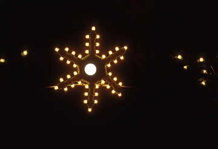 Christmas Star and full moon in the night