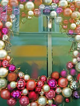 Christmas decoration with glass balls in a window
