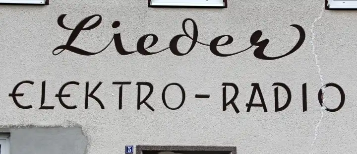 historical inscription of an electronics store