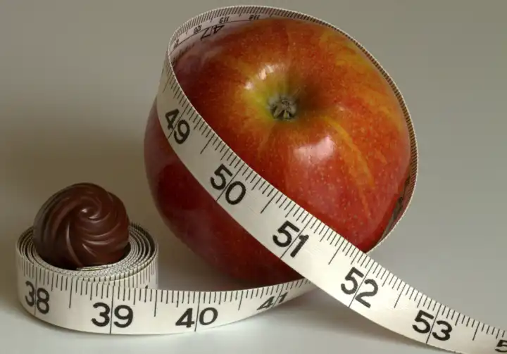 apple with measuring tape and chocolate, for the slender figure, Spring diet