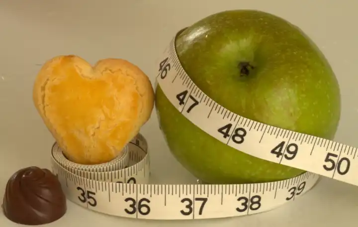 apple with measuring tape and chocolate, for the slender figure, Spring diet