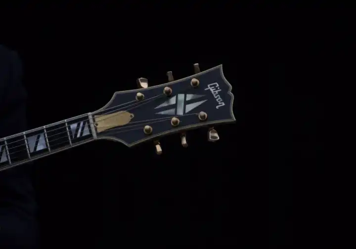 Gibson guitar on black background