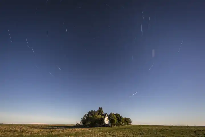 lonesome house underneath a starry sky