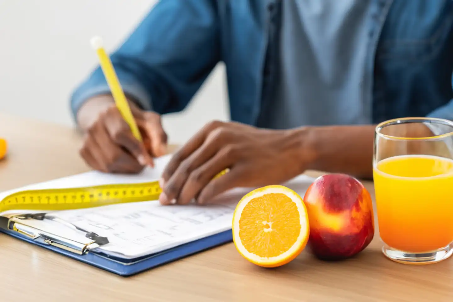 Nutritionist desk with healthy fruit, juice and measuring tape. Nutritionist working on diet plan. Weight loss and proper nutrition concept, generated with AI