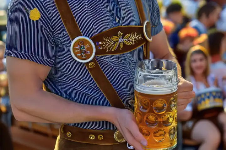 Man holding a pint of beer at the Oktoberfest, AI generated,