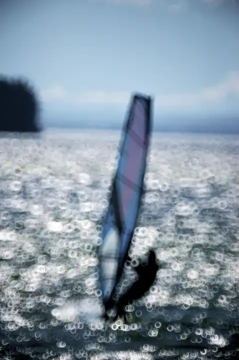 Windsurfer in backlight blur