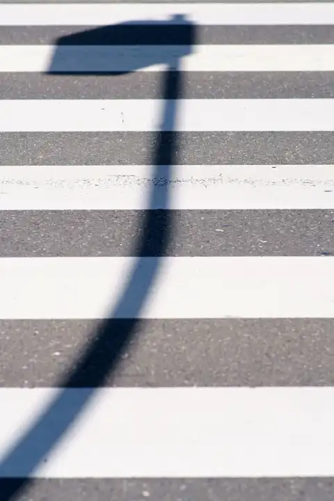 Lantern shadow on the pedestrian lane