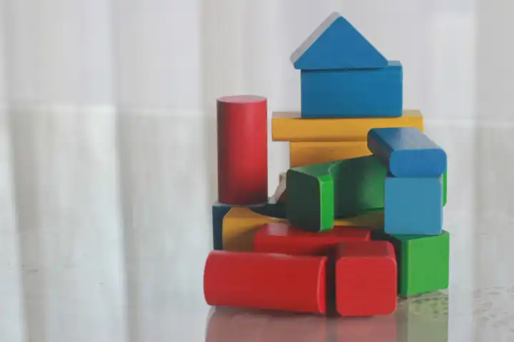 A house, build by little child, of wooden blocks