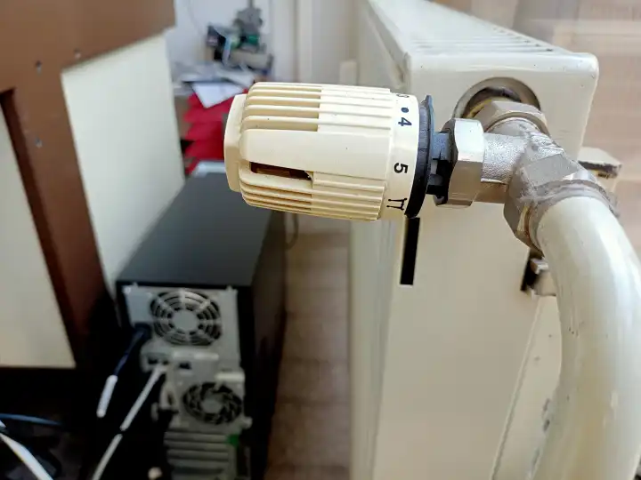 Old thermostatic valve and old radiator in office