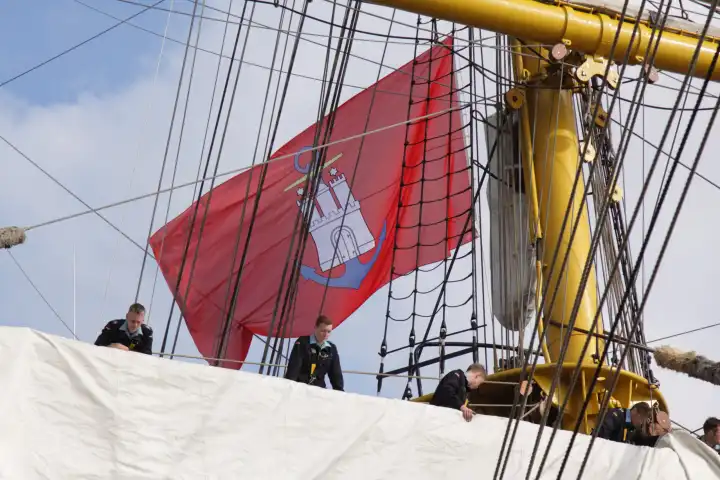 The trainig sailing ship Gorch Fock at the 824 Hamburg harbour festival with Harbour Hambrg Flag
