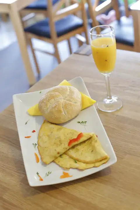 breakfast with omelette and orange juice