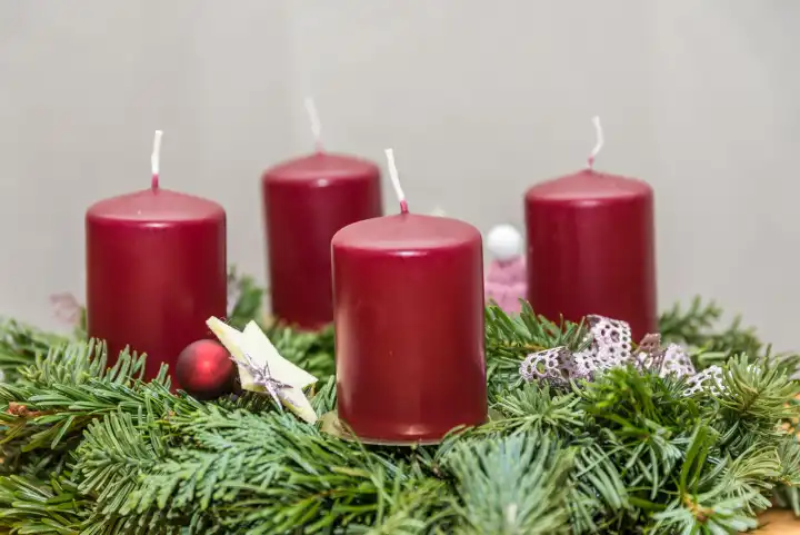 Light the advent symbol Advent wreath in front of the candle