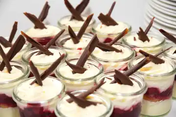 Numerous Black Forest tartlets as a dessert decorated with chocolate