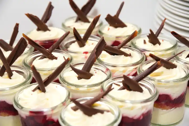 Numerous Black Forest tartlets as a dessert decorated with chocolate