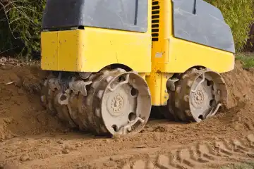 Trench roller for compacting soil on the construction site - Construction machine