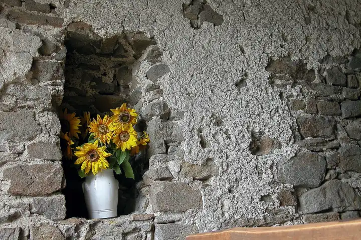 vase of flowers in a nichealcove in the wall