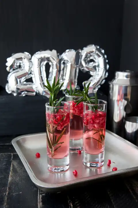 Festive drink with pomegranate and rosemary