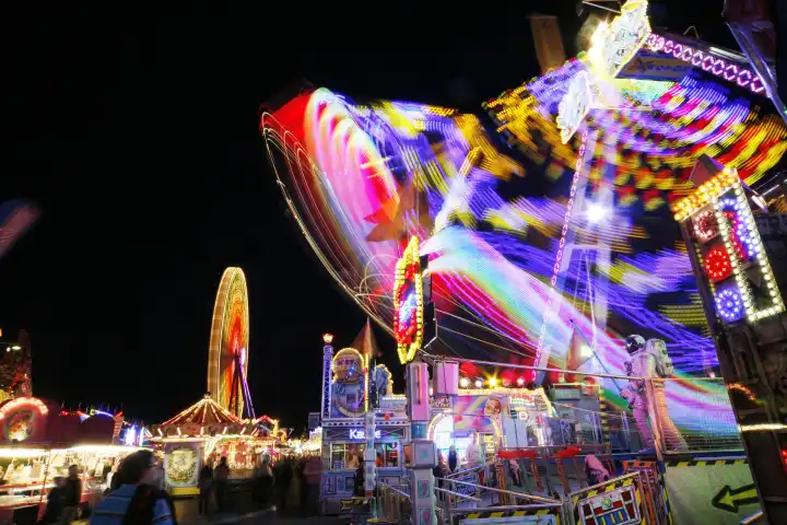 ride carousel fairs carnivals festival light strips in the evening cologne rhineland north rhinewestphalia germany europe