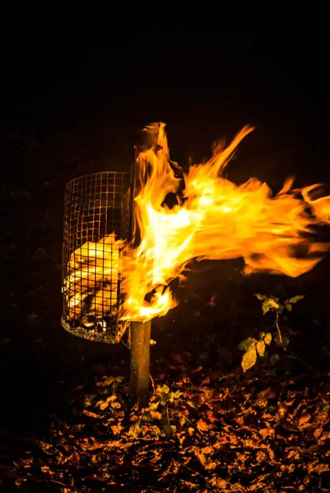burning trash / wire basket at night