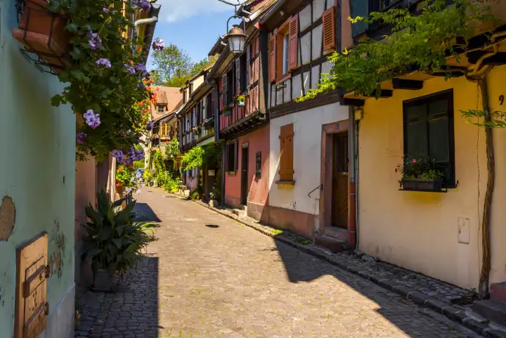 narrow picturesque lane in the touristy village Kaysersberg, Alsace, France, old town on the Wine Route