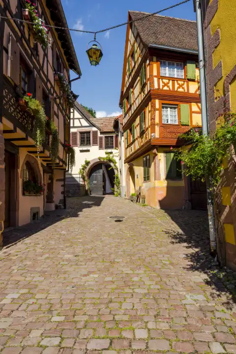 colorful picturesque lane in the historical center of village Kaysersberg, Alsace Wine Route, France