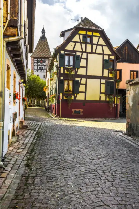 timbered houses and town gate in the village Bergheim, Alsace Wine Route, France