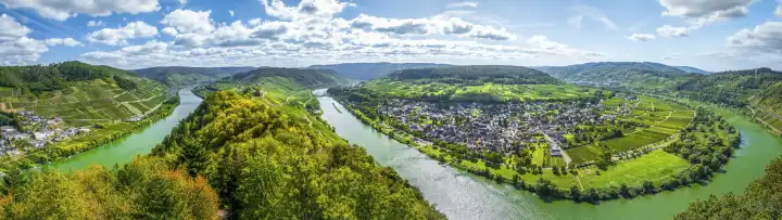 the bend of the Moselle river near Pünderich on the right, Germany, Marienburg Castle in the middle, panorama with steep vineyards and riverscape