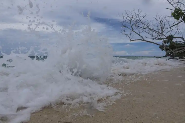 splashing waves at sandy beach