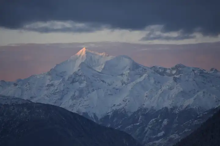 Weisshorn in the first pink light of the rising sun. Valais, Switzerland