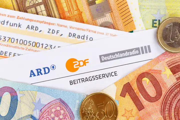 Stuttgart, Germany - September 8, 2022: Beitragsservice von ARD und ZDF Rundfunkgebühr Rundfunkbeitrag GEZ with money in Stuttgart, Germany.