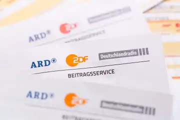 Stuttgart, Germany - September 8, 2022: Beitragsservice von ARD und ZDF Rundfunkgebühr Rundfunkbeitrag GEZ with remittance slip in Stuttgart, Germany.