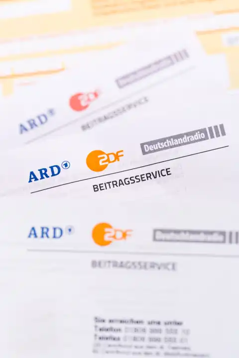 Stuttgart, Germany - September 8, 2022: Beitragsservice von ARD und ZDF Rundfunkgebühr Rundfunkbeitrag GEZ with remittance slip portrait format in Stuttgart, Germany.