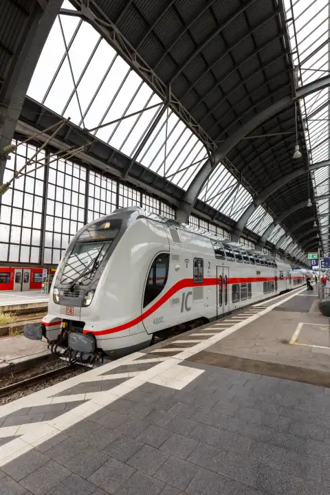 Karlsruhe, Germany - June 30, 2021: InterCity IC train of the type Twindexx Vario from Bombardier of DB Deutsche Bahn portrait format at the main station in Karlsruhe, Germany.