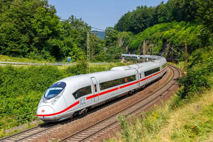 Amstetten, Germany - July 21, 2021: Deutsche Bahn ICE 3 train on Geislinger Steige near Amstetten, Germany.