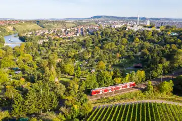 Stuttgart, Germany - October 1, 2021: DB Deutsche Bahn train regional train on Schusterbahn aerial view in Stuttgart, Germany.