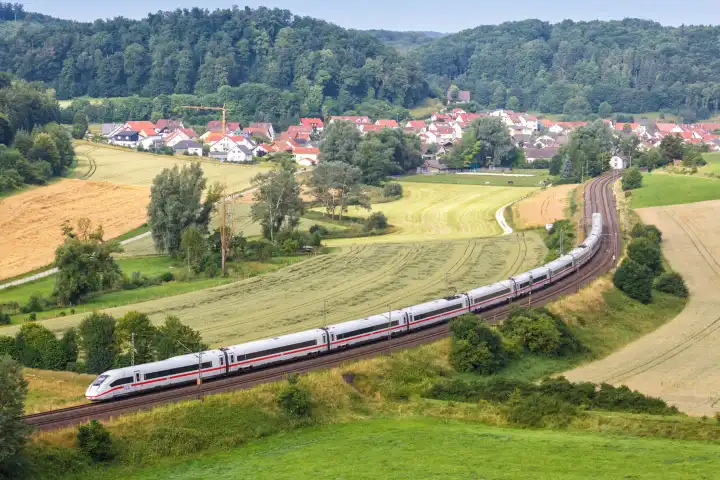 Lonsee, Germany - July 21, 2021: ICE 4 high-speed train of DB Deutsche Bahn train on the Filstalbahn near Lonsee, Germany.
