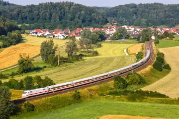Lonsee, Germany - July 21, 2021: ICE 1 high-speed train of DB Deutsche Bahn train on the Filstalbahn near Lonsee, Germany.