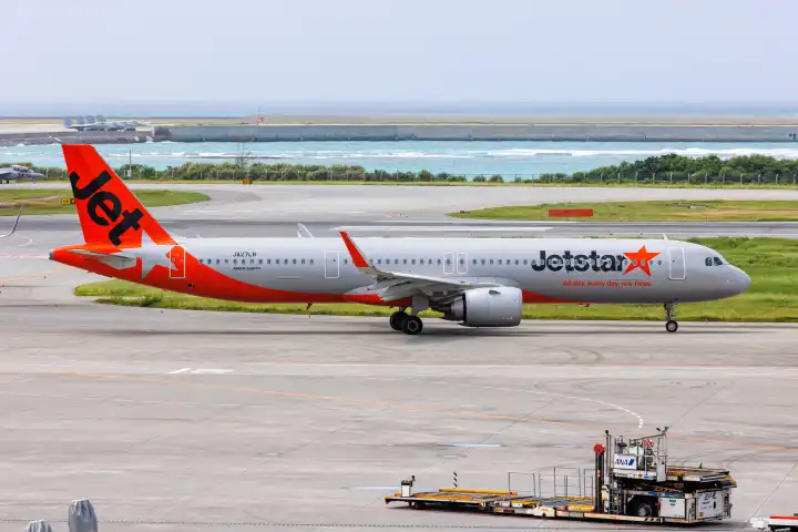 Naha, Japan - October 3, 2023: An Airbus A321neo aircraft of Jetstar Japan with the registration number JA27LR at Okinawa Airport (OKA) in Naha, Japan.
