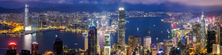Hong Kong, China - April 4, 2024: Hong Kong skyline with skyscrapers downtown panorama at night in Hong Kong, China.